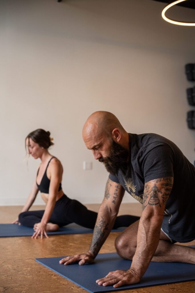 pain management clinic in kelowna bc, two people doing yoga